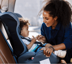 Toddler in car seat with mom